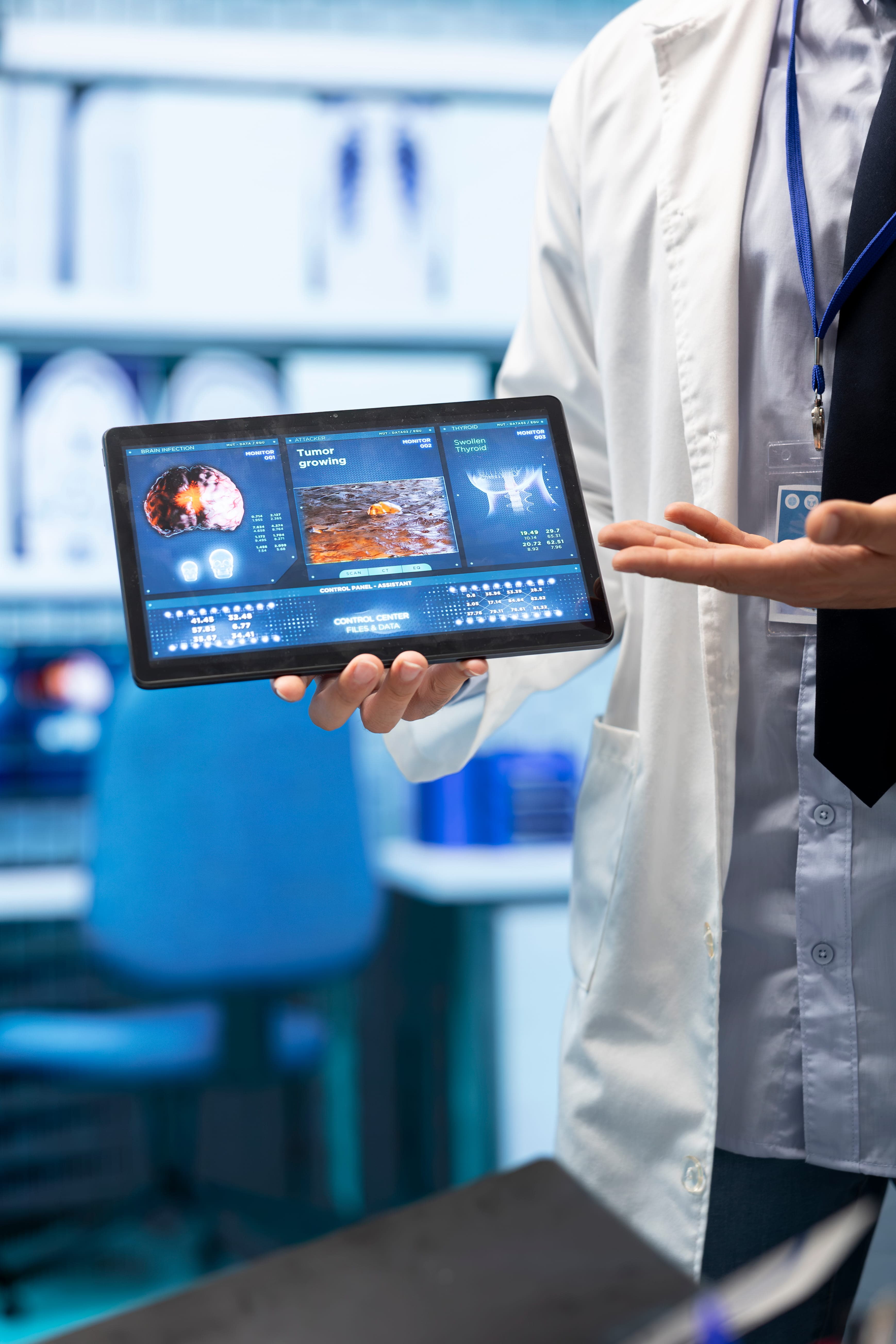 Doctor interacting with an interactive holographic display of a heart and diagnostic data